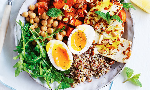 Quinoa served with eggs, chickpeas and greens
